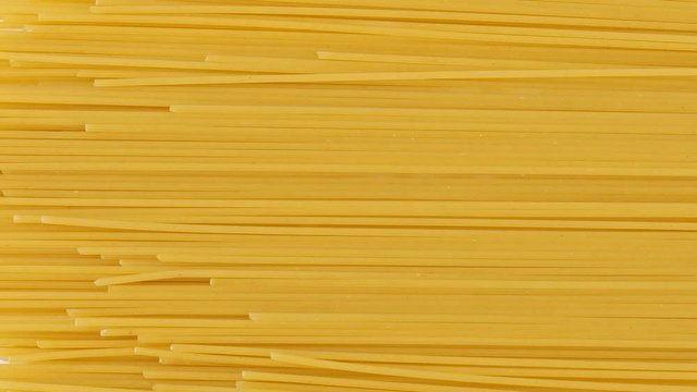 Spaghetti yellow italian pasta line pattern food background concept, Top view, Blank for design.