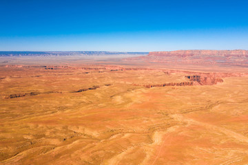 Aerial view of Arizona nature. Orange, red landscape, field, blue sky. grand canyon on background. Arizona state. USA country