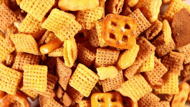  Cereal and peanut crunch mix 4k video spinning clockwise slowly top down view.