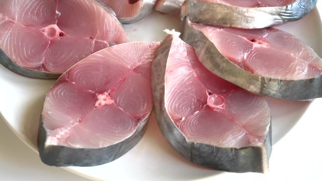 fresh raw mackerel steak on plate