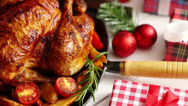 Roasted whole chicken or turkey served in iron pan with Christmas decoration