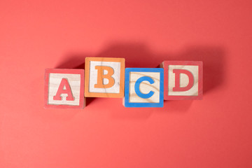 A, B, C and D wooden blocks
