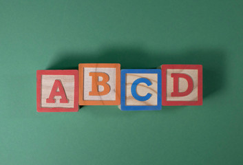 A, B, C and D wooden blocks
