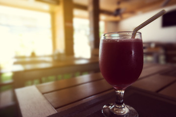 Fruit cocktail in glass on dark wooden table