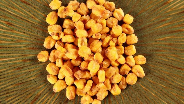 Corn nuts 4k video spinning clockwise slowly top down view