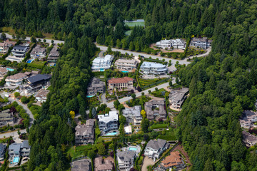 Fototapeta premium Aerial View of luxury homes in British Properties, West Vancouver, British Columbia, Canada. Taken during a sunny summer day.