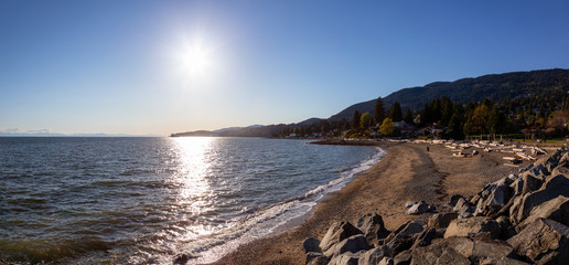 Dundarave Park, West Vancouver, British Columbia, Canada. Beautiful panoramic view of a sandy beach on Pacific Ocean Coast during a sunny summer evening.