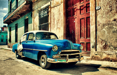 Old classic car parked in a street of Havana city
