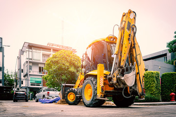Yellow Bulldozer prepare for road repair in housing Estate