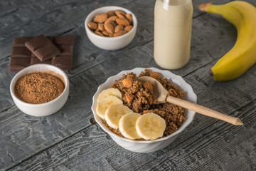 Bowl of quinoa porridge with chocolate and almond milk.