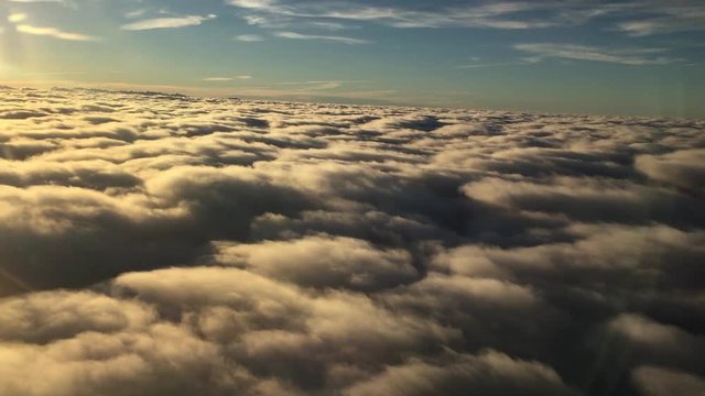 sunrise flight over clouds