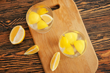 Glasses of fresh lemonade on table