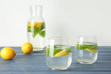 Glasses of fresh lemonade on table