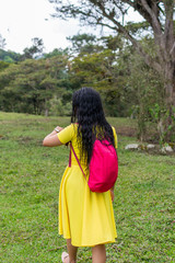 girl looking at the time while walking