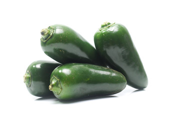 green chilies on white background (jalapeno)