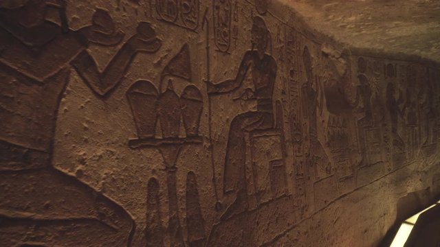 Close shot of some hieroglyphs in a wall of the Abu Simbel temple in Egypt.