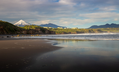 Black sand beach under mountain