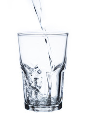 pouring water on a glass on white background clipping path