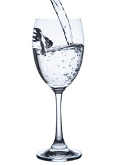pouring water on a glass on white background clipping path