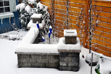A beautifully designed retaining wall functions as additional seating, and added structure and...
