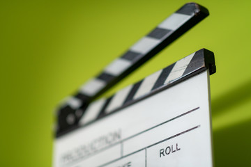 Naklejka premium movie clapper on green background
