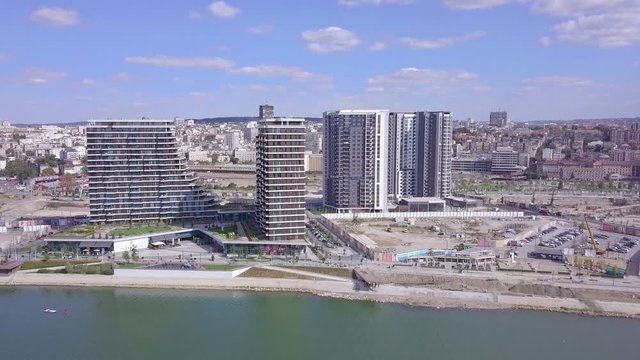 Incredible sliding and orbiting shot of Belgrade Waterfront towers on Sava river