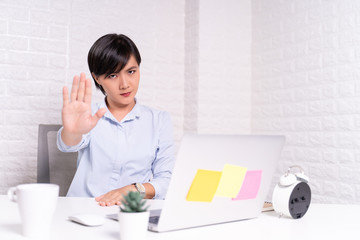 Angry woman working at office