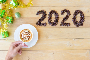 Hot cappuccino with coffee bean in 2020 year sign / Happy New year 2020