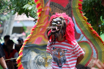 Jatilan/Jhatilan dancer using various mask.
