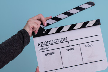 movie clapper on cyan background