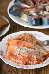 Salted chum salmon with spices on a white plate