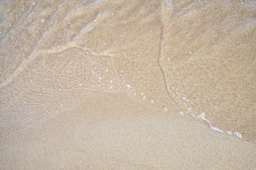 texture of yellow sand on the sea