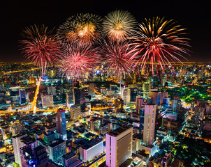 Fireworks celebrating over Bangkok cityscape at night, Thailand