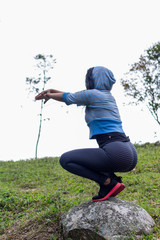 Woman exercising in the field