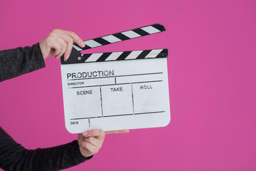 movie clapper on pink background