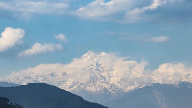 Day Timelapse of Gauri-Shankar Himal Mountain as seen from Charikot Bazaar in Dolakha, Nepal. Very tight shot.