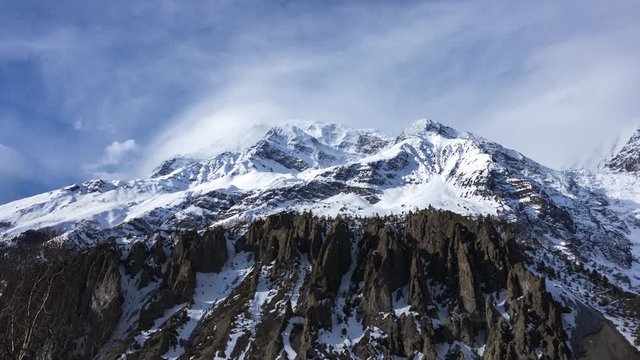 Day timelapse of Annapurna Mountain Range with clouds in a Sunny day from Manang, Nepal.Wide shot.