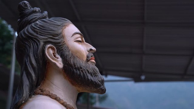 This statue is built on the banks of the Ganges in Rishikesh. which a yogi is practicing meditation.