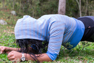 Woman exercising in the field