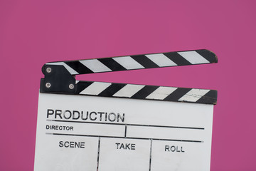 movie clapper on pink background