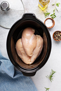 Raw Chicken Breast In A Slow Cooker Ready To Be Cooked