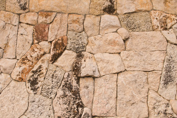 Background texture of the old fortress stone wall. Conceptual background for designers. Selective focus.