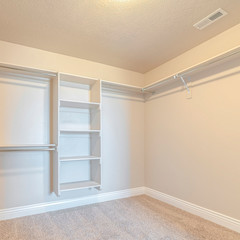 Fototapeta na wymiar Square frame Interior of walk in closet with bare shelving