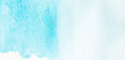 Abstract strokes of blue watercolor paint for the background