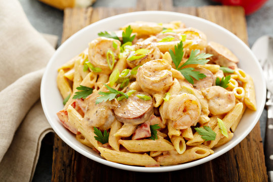 Cajun Shrimp And Sausage Penne Pasta In A Bowl