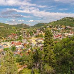 Fototapeta na wymiar Square frame Ski Resort in Park City Utah with lush greenery and buildings viewed in summer