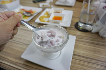 Small round balls made from taro mixed with tapioca flour with sweet coconut milk, Thai dessert called Bualoy.