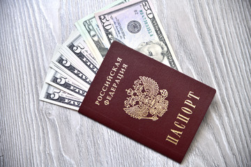 Russian foreign passport and an dollar banknote