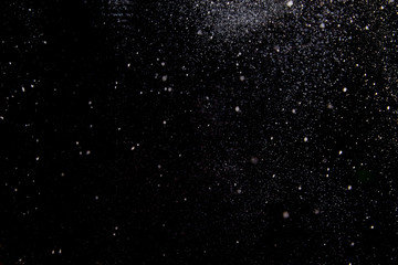 Abstract dust explosion on a black background