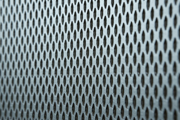 The texture and pattern of perforated metal.